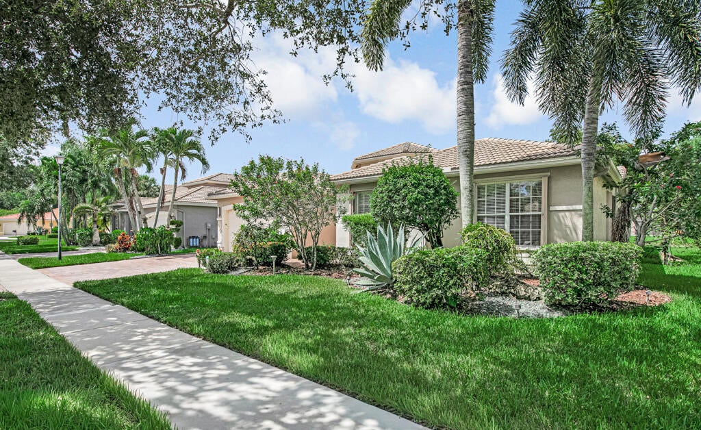Photo of 7911 Ferndale Bend Drive, Lake Worth, FL 33467 (MLS # B26070640)
