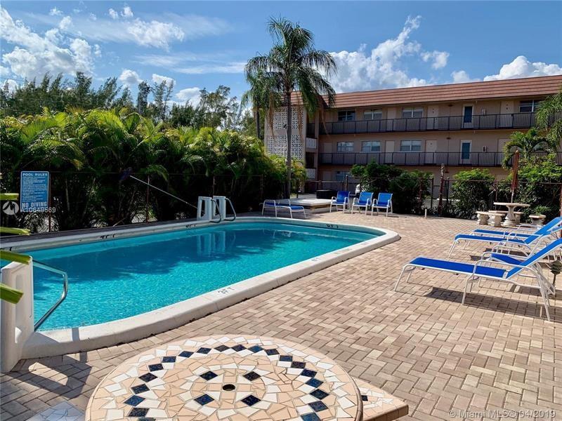 Photo of 3930 Crystal Lake Dr #307, Deerfield Beach, FL 33064 (MLS # F10312670)