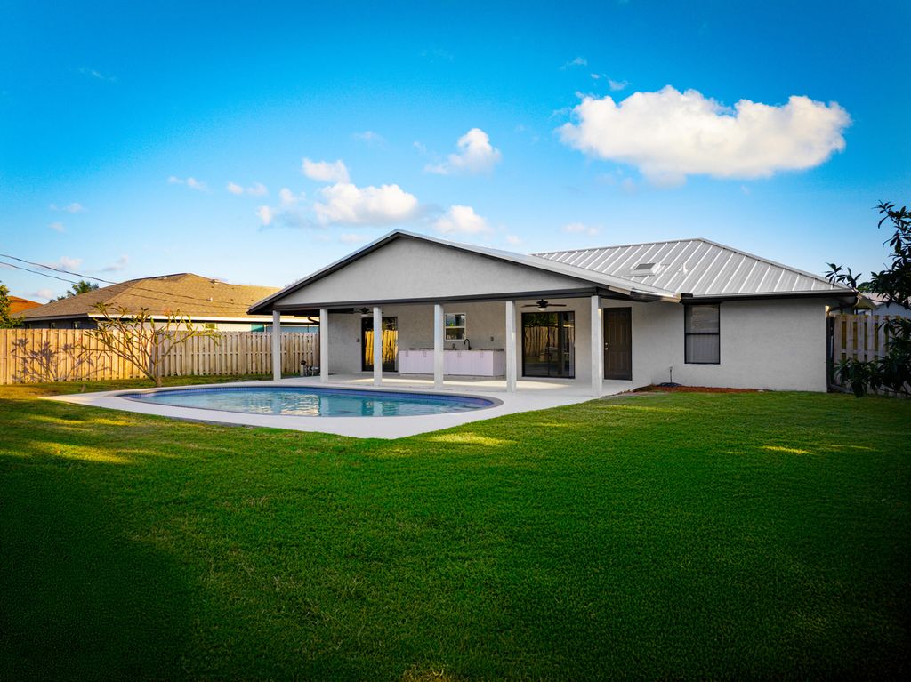 Photo of 431 SE Volkerts Terrace, Port Saint Lucie, FL 34983 (MLS # R11127083)