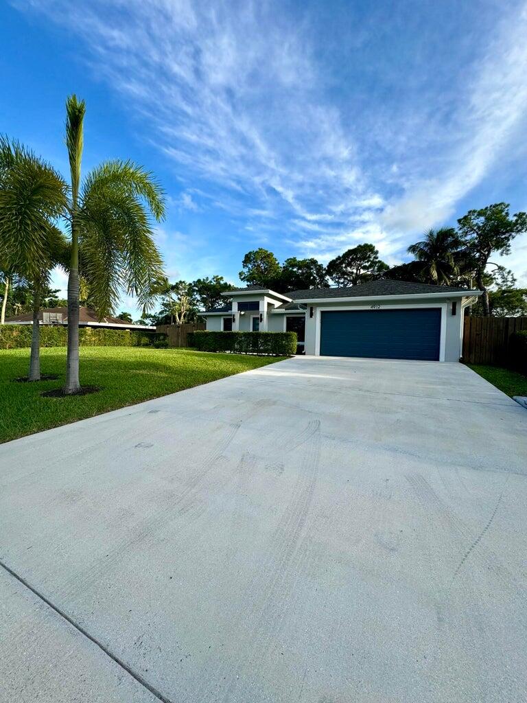 Your perfect home awaits! Built in 2021, this bright and inviting residence features soaring ceilings, an open modern kitchen, and impact windows and doors for comfort and peace of mind. The spacious backyard is perfect for relaxing or entertaining, complemented by a large driveway, a 2-car garage, and a 12' x 6' storage shed for all your extras. With no HOA, you'll enjoy true freedom and flexibility. The home is thoughtfully wired for security cameras and ideally located within walking distance to top-rated schools. Just minutes from shopping, highways, and the hospital this move-in ready home has it all!