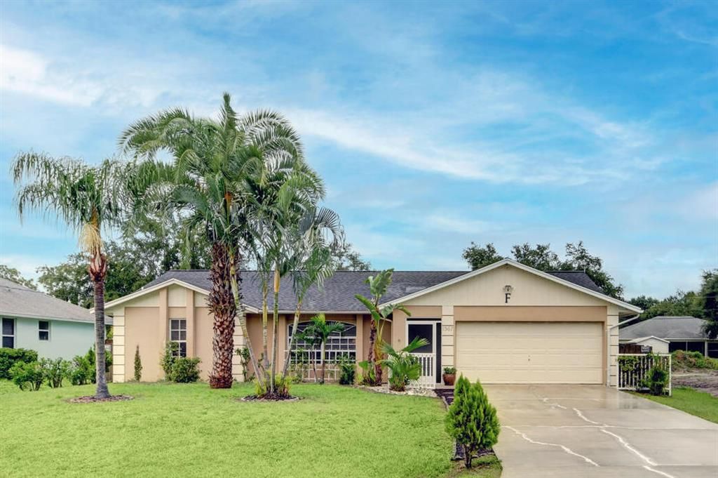 Photo of 1367 SW Granville Avenue, Port Saint Lucie, FL 34953 (MLS # R10739336)
