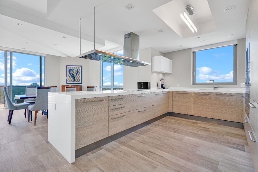 Impeccably furnished and professionally decorated corner unit at The Reserve at Marina Palms. This 2-bedroom, 2.5-bath residence with a converted den offers 1,958 sq ft of elegant living space. Enjoy stunning south and southwest bay and lake views from the expansive living area and oversized terrace. The open kitchen features high-end appliances and custom cabinetry. Architectural details, custom doors, and designer window treatments elevate the interior. The primary suite includes a sitting area, walk-in closet, and spa-inspired bath. Includes 1 assigned parking space and large storage. Luxury amenities include lagoon front pool, summer kitchen, fitness center, spa, playroom, and more. Enter this lovely corner unit, Unit 1702 at The Reserve at Marina Palms — a designer-furnished, move-in-ready corner residence offering exactly 1,958 sq ft of refined luxury. This spacious 2-bedroom, 2.5-bath layout includes a den thoughtfully converted into a third bedroom, perfect for guests or a home office. Bask in breathtaking south and southwest views of the bay, Intracoastal, and lake through floor-to-ceiling windows and from a large private terrace ideal for indoor-outdoor living.The open-concept kitchen is outfitted with premium appliances, sleek cabinetry, and upscale finishes. Architectural accents, custom doors, and top-tier window treatments bring sophistication to every room. The primary suite offers a peaceful retreat with a sitting area, generous walk-in closet, and a spa-inspired bath with soaking tub and glass-enclosed shower.Located within one of North Miami Beach’s premier luxury condominiums, The Reserve at Marina Palms features resort-style amenities including a bayfront pool and spa, summer kitchen, state-of-the-art fitness center with steam and sauna, children’s playroom, social lounge, news café, and a full-service marina with slips available for purchase.Enjoy privacy, security, and the very best of South Florida waterfront living, just minutes from Aventura, Bal Harbour, and Sunny Isles Beach.