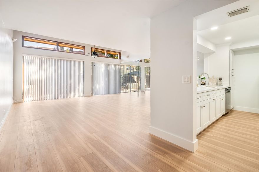 Come see this newly remodeled open concept townhouse featuring a brand new kitchen and downstairs flooring. At almost 1900 square feet under air and tons of natural light, this renovated townhome in the heart of Plantation is perfect for the family or friends needing some space with their own personal bathrooms. All three bathrooms have also been recently remodeled. Large living room/dining room with kitchen featuring bar seating and SS appliances. Fenced back patio great for outdoor dining and entertaining. Unit comes with W/D and two assigned parking spaces directly in front with ample guest parking. Community has a pool, tennis court, and play area for the kids. Close to central park and the new Plantation Walk.