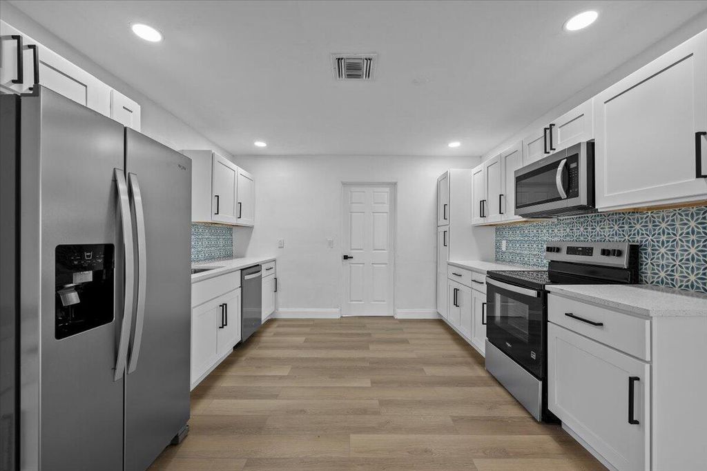 Photo of 1612 Sherwood Avenue, Mangonia Park, FL 33407 (MLS # B26017007)