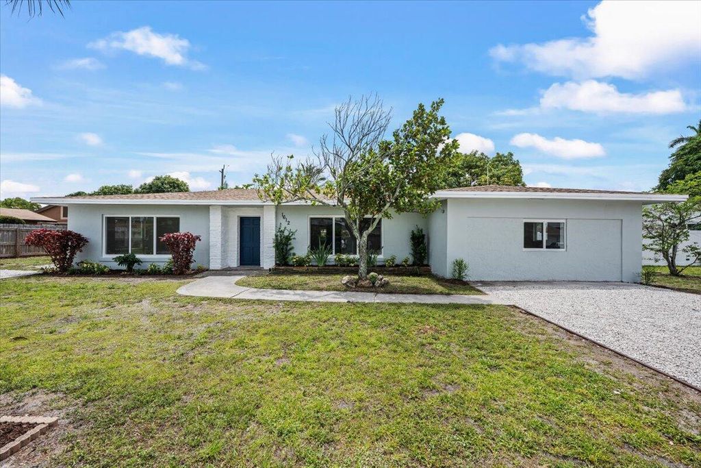 Photo of 1612 Sherwood Avenue, Mangonia Park, FL 33407 (MLS # B26017007)