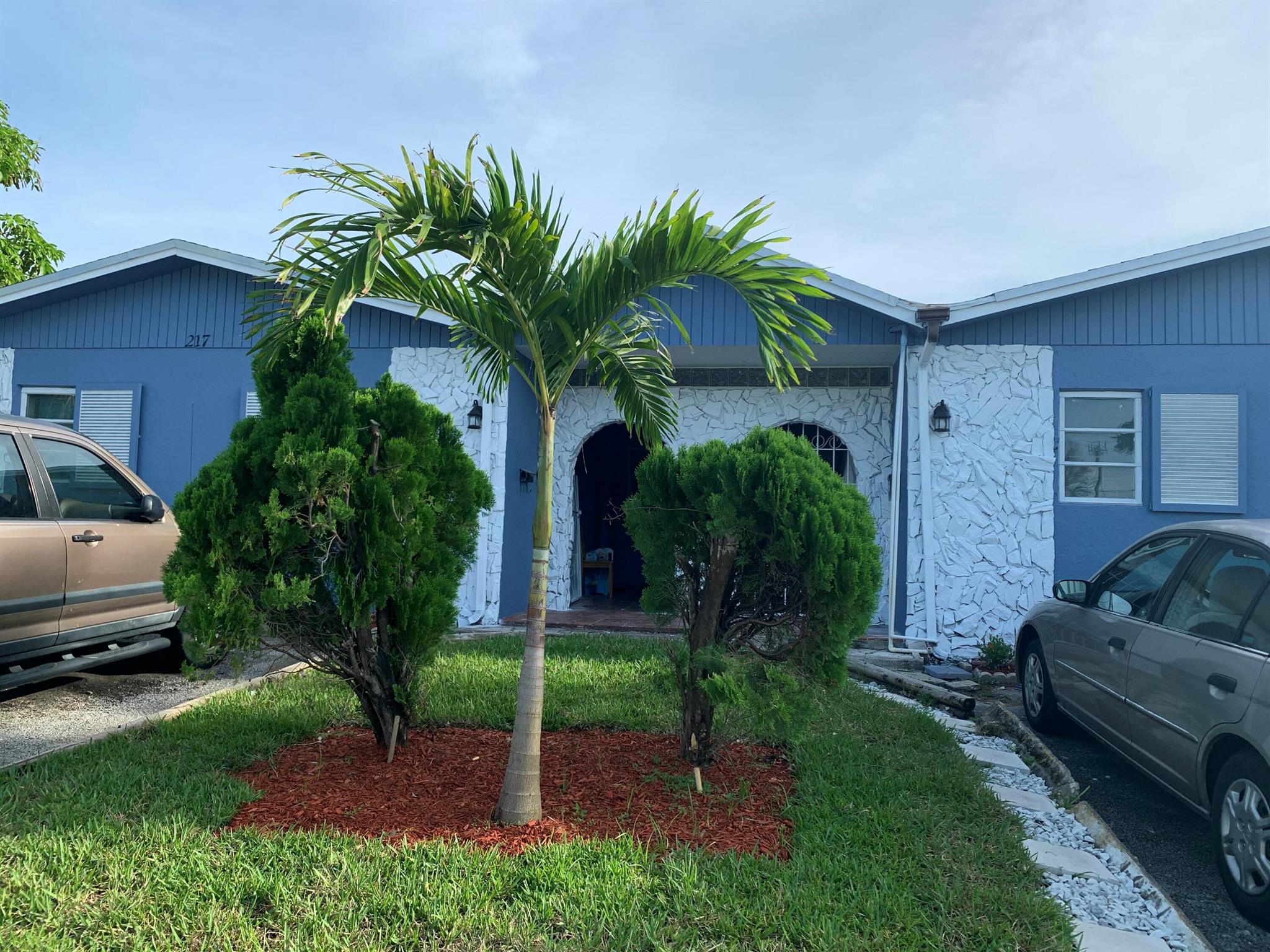 Stunningly Renovated 4-Bedroom, 3-Bath Ready To Move-in duplex in BOYNTON HEIGHTS. Walking distant to the library and close to beach & No HOA!!! Welcome to this rarely available and elegantly updated 4-bedroom, 3-full-bath duplex with 2 masters bedroom located in the quiet neighborhood, From the moment you step inside, you'll appreciate the thoughtful renovations and spacious layout designed for both comfort and style. The heart of the home is the open-concept kitchen, featuring a stunning quartz countertop, sleek stainless-steel appliances, and ample cabinet space. The main living area is finished with vinyl flooring, beautiful lightning, chandelier and all impact windows throughout the home.House can be rented as 4-bedroom 3 bath @ $4200 or 3bedroom, 2bath @$3200.