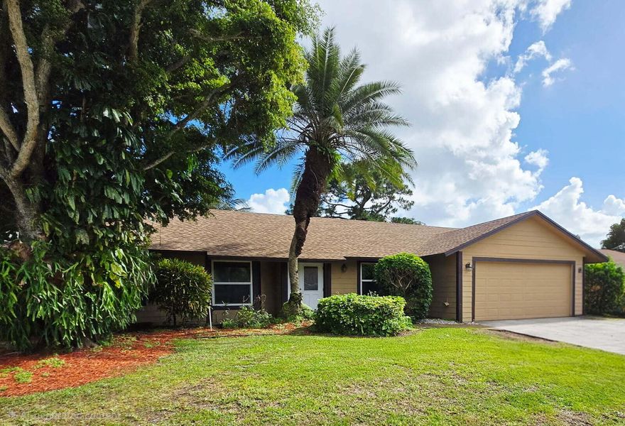 HURRY! All the heavy lifting has been done here. Roof, Impact Windows, A/C, water heater (all major items replaced over last 3-5 years!), siding replaced with cement / fiber board,  kitchen updated with tons of cabinet space (soft close doors and drawers) large island and granite tops. Primary bedroom is oversized with newer walk in shower/ frameless glass enclosure. The living room features vaulted ceilings, this is a split bedroom plan with generous sized bedrooms. There is a large covered porch, good sized yard (fenced) full laundry/utility room, even a walk-in pantry! The garage is full 2 car and offers additional storage space and there's even a shed! Bring your design ideas, this home is ready for the next generation.