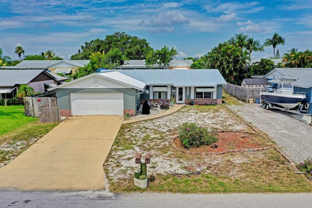 Photo of 8972 SE Sandridge Avenue Ave, Hobe Sound, FL 33455 (MLS # R10811766)