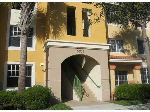 Rarely available 1st floor unit! This spacious 3-bedroom, 2-bathroom condo boasts freshly painted walls throughout and modern upgrades; fully updated open-concept kitchen featuring quartz countertops, sleek laminate flooring; fully upgraded master bathroom offers a luxurious rain shower for relaxation. WATER AND CABLE INCLUDED !Located in a sought-after community, desirable amenities; pool, fitness center, kids' playground, and splashpad. Take a stroll around the serene lake with a scenic walking trail right within the neighborhood.Conveniently situated within 5 miles from the beach and surrounded by nature preserves, this property offers the perfect blend of coastal living and outdoor recreation. Easy access to Interstate 95 and Florida's Turnpike makes commuting a breeze.