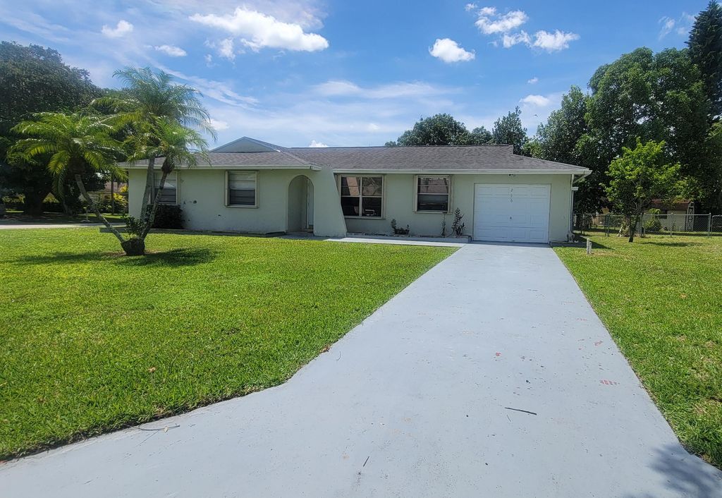 Photo of 296 Sandpiper Avenue, Royal Palm Beach, FL 33411 (MLS # B26027215)
