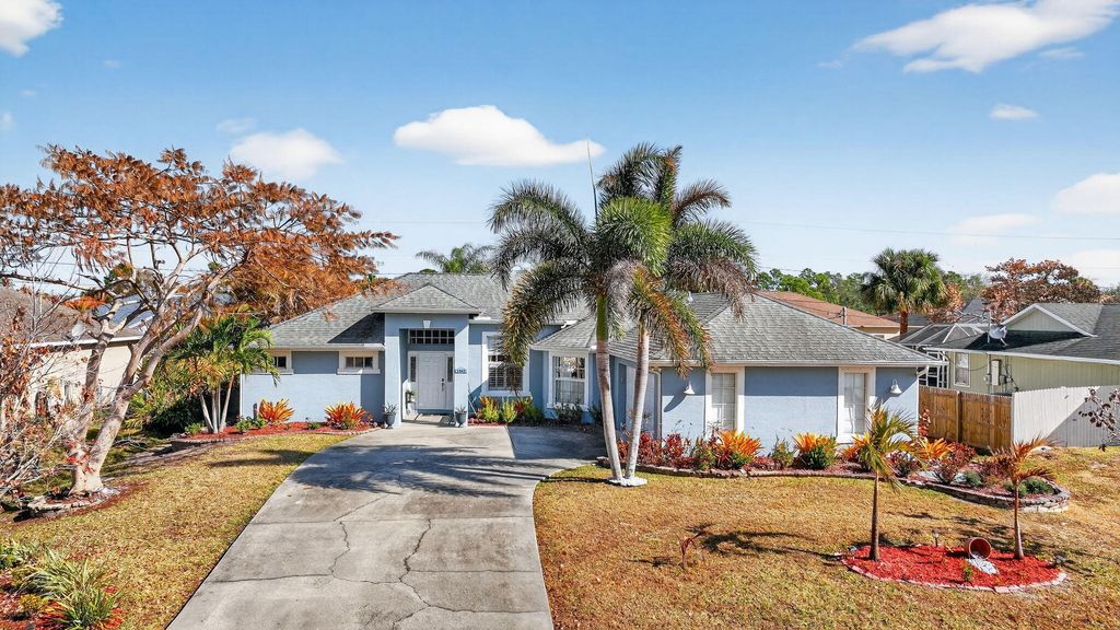 Photo of 1465 SW Flounder Lane, Port Saint Lucie, FL 34953 (MLS # R11163645)