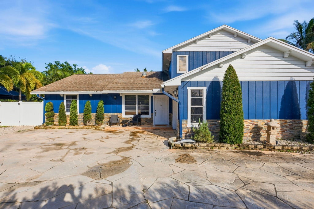 Photo of 9220 LAWRENCE Road, Boynton Beach, FL 33436 (MLS # B26094632)