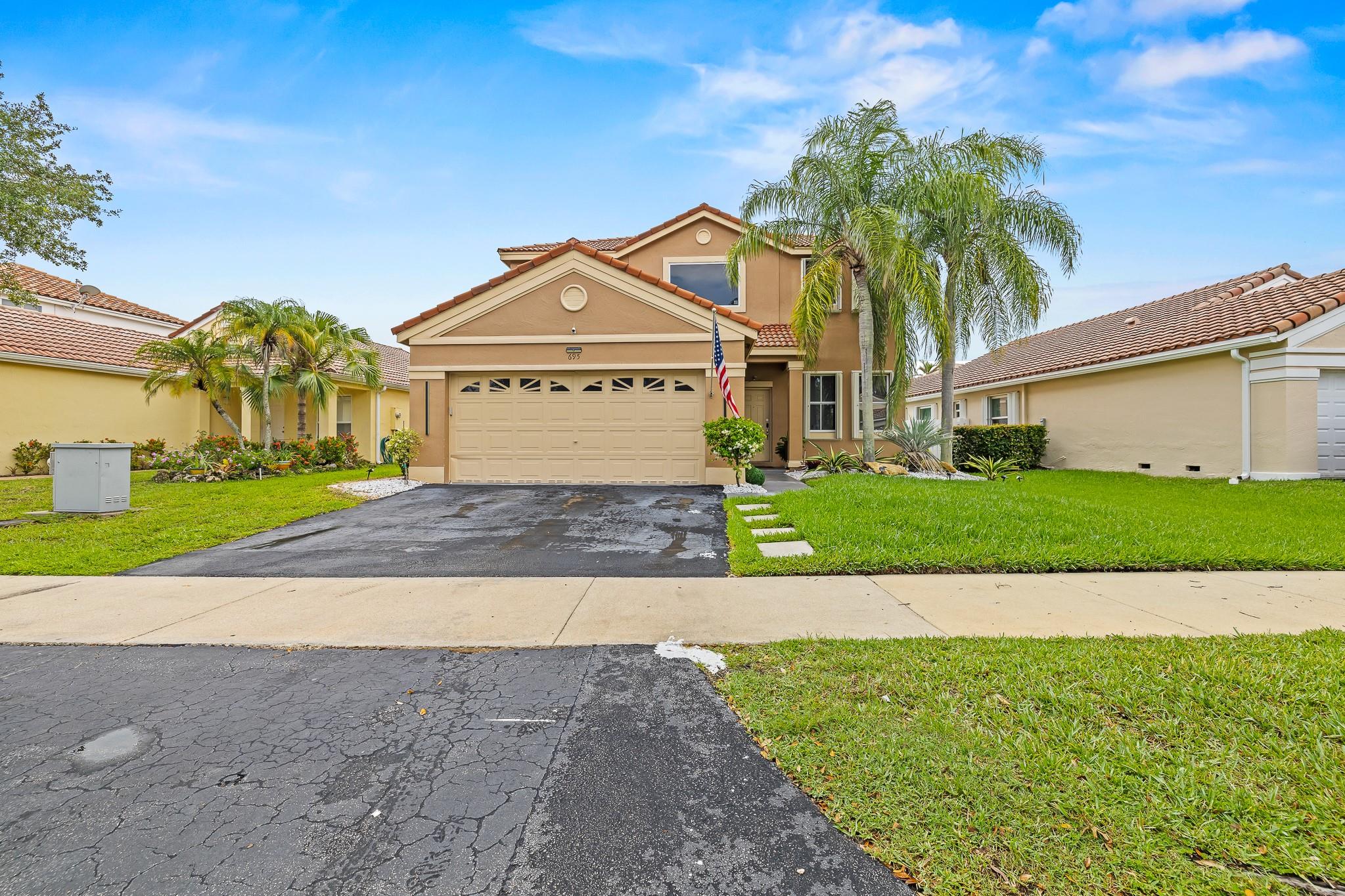 Beautiful remodeled home 4 beds/2.5 baths in desirable North Lakes community, with 2 car garage. Porcelain floors on 1st floor, Laminate wood flooring on stairs & 2nd floor. Newer kitchen w/modern 42" cabinets, granite countertop, with top of the line Stainless Steel Appliances. New A/C in 2024 and Hot Water Heater replaced in 2023. All bathrooms upgraded with designer features. Step outside to a beautifully landscaped fenced backyard with covered patio, perfect for entertaining and room to build a pool too! Community has access to A+Schools, close to major highways,restaurants,shopping,etc. Located in exclusive guard gated Weston Community, with hurricane shutters. HOA Approval Required.