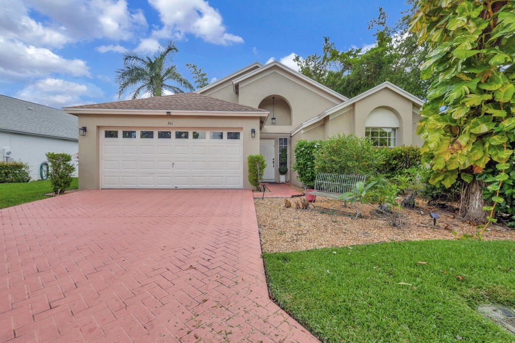 Photo of 361 Hammocks Trail, Greenacres, FL 33413 (MLS # R11000202)