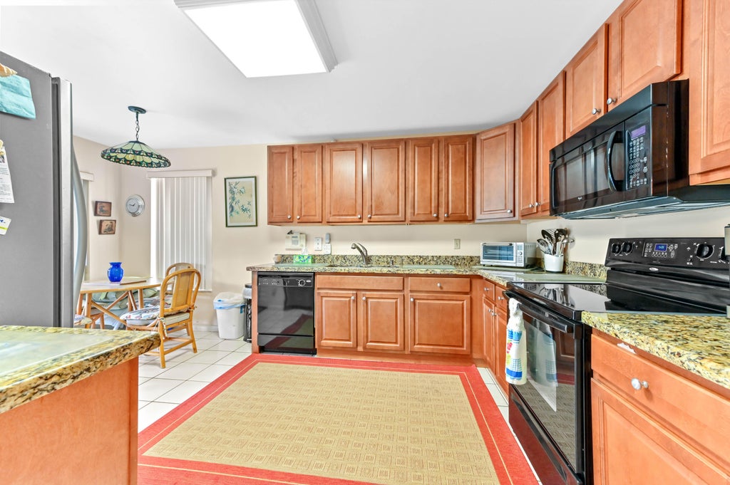 Photo of 3385 Jog Park Drive, Greenacres, FL 33467 (MLS # B26069539)