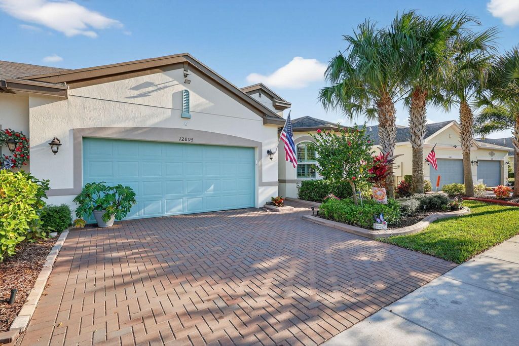 Photo of 12895 SW Lake Fern Circle, Port Saint Lucie, FL 34987 (MLS # R11140985)