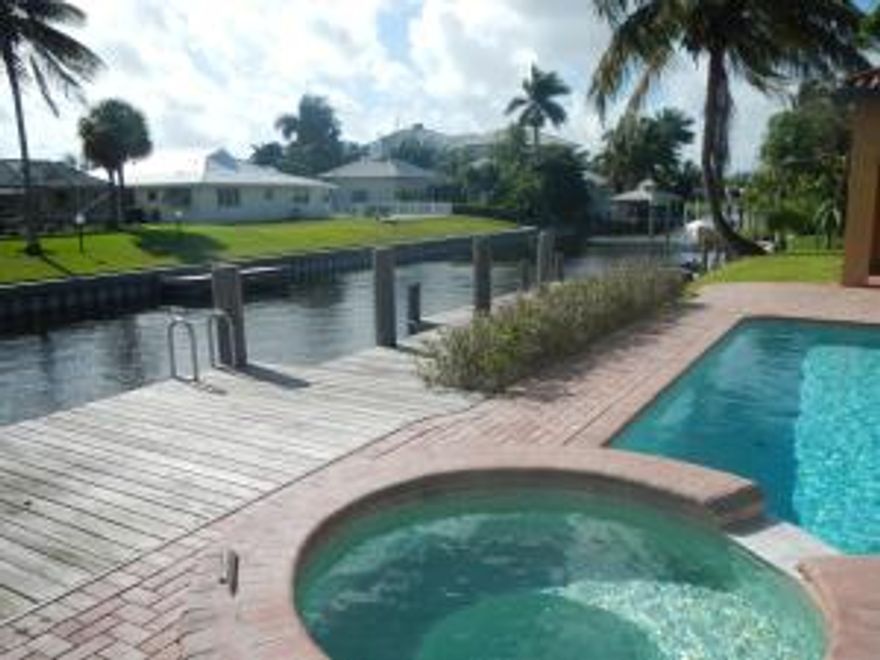 Remarkable waterfront pool home with 100 ft of frontage on canal leading to Lake Eden and Lake Ida. Phenomenal square footage for the area in a newer home, 5BR/4.5BA including a separate office and game room. Spacious downstairs master bedroom withcoffered ceiling, walk in closet and renovated master bath. Upstairs includes a loft, ideal as secondary entertainment area as well as 4BR's, two renovated bathrooms and full size laundry closet. Kitchen features granite counters, newer ss appliances and oversized pantry. Backyard is ideal for outdoor living with covered patio, resurfaced pool, pavered deck area and custom built dockage. Interior courtyard include lush landscaping and soothing water feature. Finally, an oversized 2 car garage featuring loads of storage. Please note guest house sq