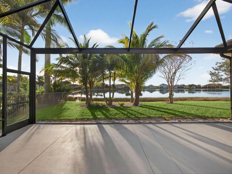 Experience waterfront living in this elegantly updated 5-bedroom, 3-bath lakefront home, nestled within the prestigious Estates at Tradition. Enhanced by soaring ceilings and grand ten foot doorways this spacious home features a collection of high-end improvements that provide comfort, style, and everyday functionality. Enjoy seamless indoor-outdoor living on the extended, fully enclosed screened lanai, where west-facing exposure offers breathtaking sunset views over the tranquil lake, ideal for relaxing mornings, evening respite, or refined entertaining. The large kitchen boasts new premium appliances installed between 2023 and 2024, including a refrigerator, dishwasher, microwave, and water heater, providing modern efficiency and peace of mind. Tile floors in the living areas and luxury laminate  in the bedrooms provide a clean, contemporary, and low-maintenance interior throughout the home. 

Residents of the Estates at Tradition enjoy access to scenic walking trails and a private community pool just a short walk from the home, enhancing the walkable, resort-style lifestyle that makes Tradition so desirable. Situated in one of Tradition's most desirable estate communities, this exceptional lakefront residence offers a rare blend of luxury, privacy, and thoughtful upgrades in a truly premier setting.