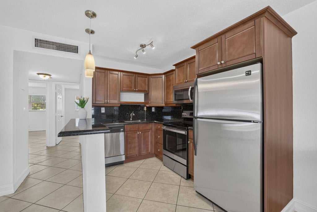 Photo of 4051 NE 13TH Avenue NE #76-3, Oakland Park, FL 33334 (MLS # B26074966)