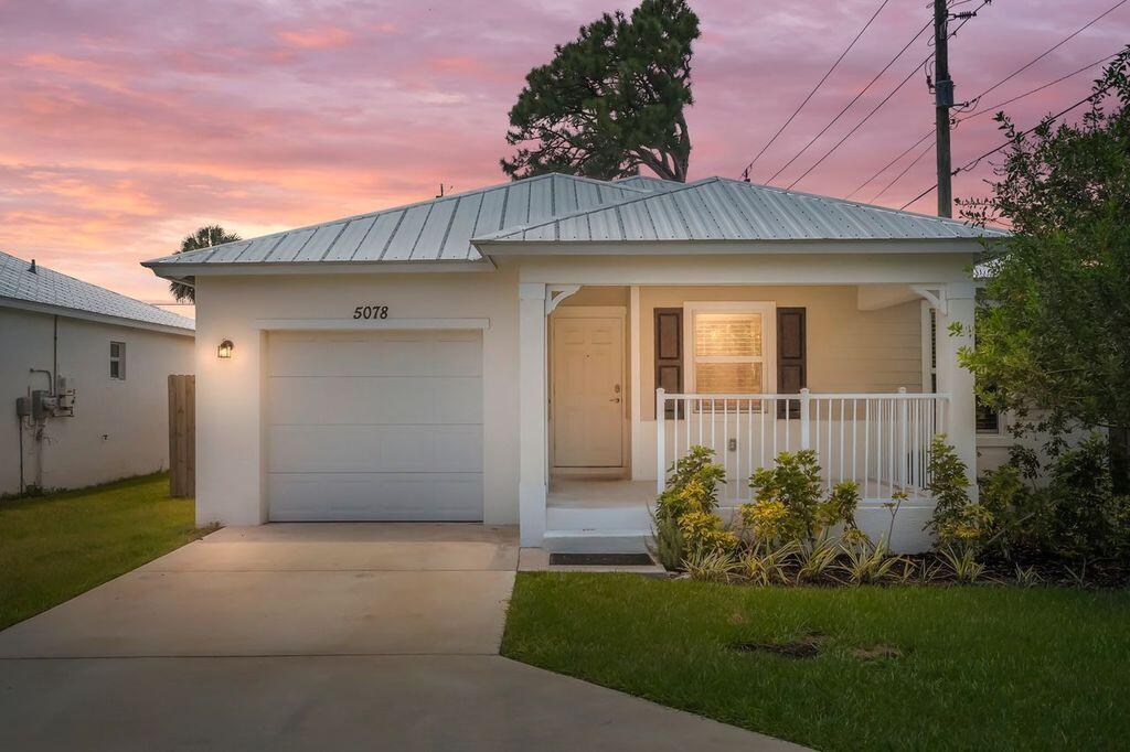 Beautiful home completed June 20233 bedroom 2 bath 1 car garage, vaulted ceilings, wood look tile plank in main living area and carpet in bedrooms, quartz kitchen counter tops, stackable washer and dryer. Stainless steel GE appliances. Complete impact windows and doors throughout. Bright and open split floor plan, kitchen counter seats 4 with barstools. Covered Front porch, with beautiful upgraded accent fence, auto sprinkler system. And let's not forget fully fenced back yard featuring fruit trees.Minutes from downtown Port Salerno, boat ramps ,grocery, shopping, waterfront dining, close to I-95 and hospital.