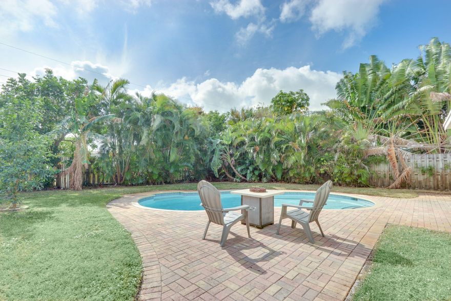 Beautifully renovated 4 bed, 3 bath home with freeform pool and fenced yard, All hurricane impact windows & patio door, Beautiful New Kitchen with white cabinets, white quartz counter tops and new stainless steel appliances, beautiful new master bathroom, New Custom White California Plantation Shutters throughout, Tile floors in all living areas, Inside laundry with washer & dryer, Spacious rooms, Large Fenced Yard, Sprinklers on a Well for LOW water bills,  12'x18' Shed is set up for workshop with AC & electric, Screened Patio, Circular Driveway, Low traffic & quiet street, All new landscaping is contracted to be installed by 1st week in July, close to shopping, banks, beach and Deerfield Fishing Pier, Restaurants, I95. Lawn & Pool maintenance included. Shows Beautiful!