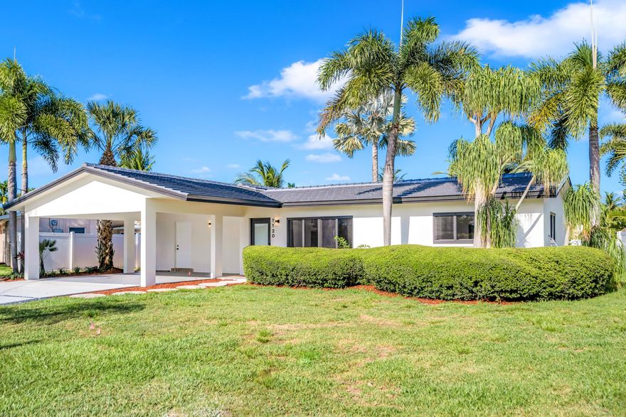 Live in East Pompano Beach's highly desirable Cypress Lakes neighborhood. No expense spared! This fully renovated home features high-end finishes for move-in-ready convenience. Interior highlights include quartz countertops and warm natural wood cabinetry with LVP and tile flooring throughout. Luxurious baths designed with walk-in showers are just steps away from the sparkling pool! Enjoy waterfront living with ~65 ft of deep-water frontage and just one fixed bridge to the ocean. Upgrades include a new roof (2026), new HVAC, impact windows and doors, newly built 21' Dock, indoor utility room, and 2-car carport. Minutes to the beach, pier, golf, dining and shopping. Welcome Home!