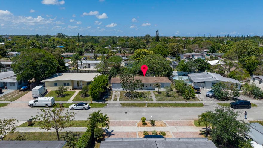 Opportunity in Deerfield Beach - 3 Bed / 2 Bath with Huge Yard!  Welcome to this 3-bedroom, 2-bath single-family home located in a quiet residential neighborhood of Deerfield Beach. Sitting on an oversized lot, this property offers incredible potential for homeowners or anyone looking to customize a home to their taste.  The home features a functional layout a large backyard with plenty of room for outdoor entertaining, expansion, or storage for boats, RVs, or work vehicles. There is also a separate private entrance to an additional space, offering flexibility for guests, extended family, or a home office setup.  This property is being sold AS-IS and presents a great opportunity for renovation, rental income potential Conveniently Located east of  I 95 Highway .