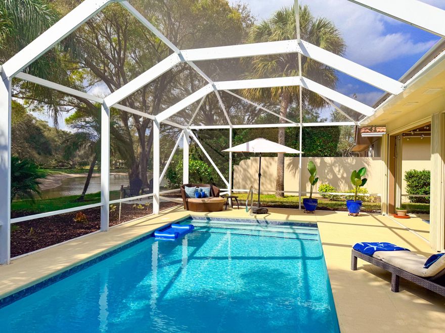 The combination buyers wait for in Oaks East, a private pool paired with expansive lake views, a rare offering in this sought-after community. Nestled beneath oak-lined streets in one of Palm Beach Gardens' most desirable guard-gated neighborhoods, this 3BR/2BA Divosta-built CBS home sits on a premier lot with private, tranquil views. Inside, soaring ceilings and a spacious open-concept layout enhance the home's light-filled ambiance. Engineered stained bamboo flooring runs throughout, complemented by an updated kitchen with stainless steel appliances and a beautifully renovated primary bath. A split floor plan provides privacy, with two additional bedrooms and a well-appointed guest bath. Extensive improvements include a replaced roof, gutters, skylights, attic insulation, garage door, newer lighting, epoxy-coated 2-car garage, and interior and exterior paint. New sliding glass doors invite abundant natural light and open seamlessly to the resurfaced and retiled pool, expansive patio, and newer screened enclosure, creating a serene indoor-outdoor retreat overlooking the lake. Ideally located just minutes from premier shopping, award-winning dining, top beaches, world-class golf, I-95, the FL Turnpike, and PBI Airport. This is a rare opportunity to enjoy the very best of Palm Beach Gardens living.