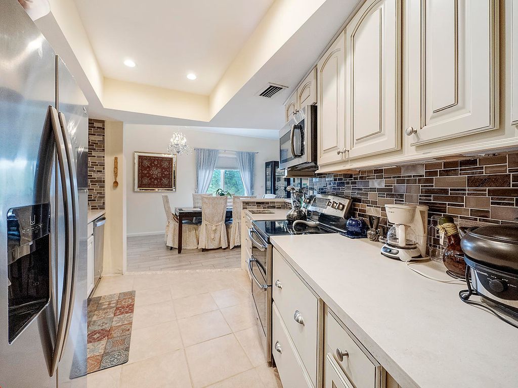 Photo of 11811 Ave Of The Pga, West Palm Beach, FL 33418 (MLS # B26007529)