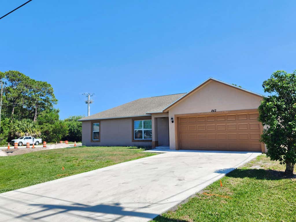 Photo of 842 SE Walters Terrace, Port Saint Lucie, FL 34983 (MLS # B26040836)