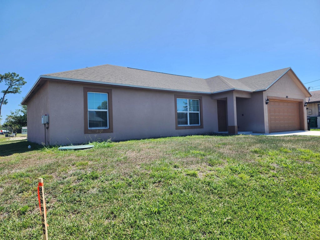 Photo of 842 SE Walters Terrace, Port Saint Lucie, FL 34983 (MLS # B26040836)