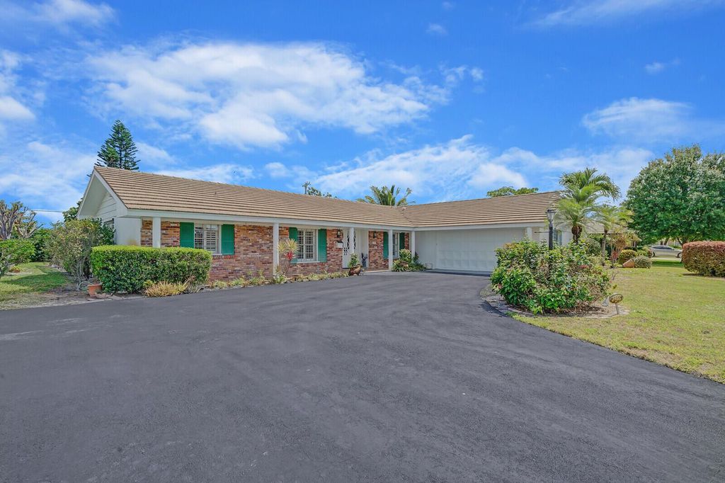 Photo of 220 N Country Club Drive, Atlantis, FL 33462 (MLS # R10987155)