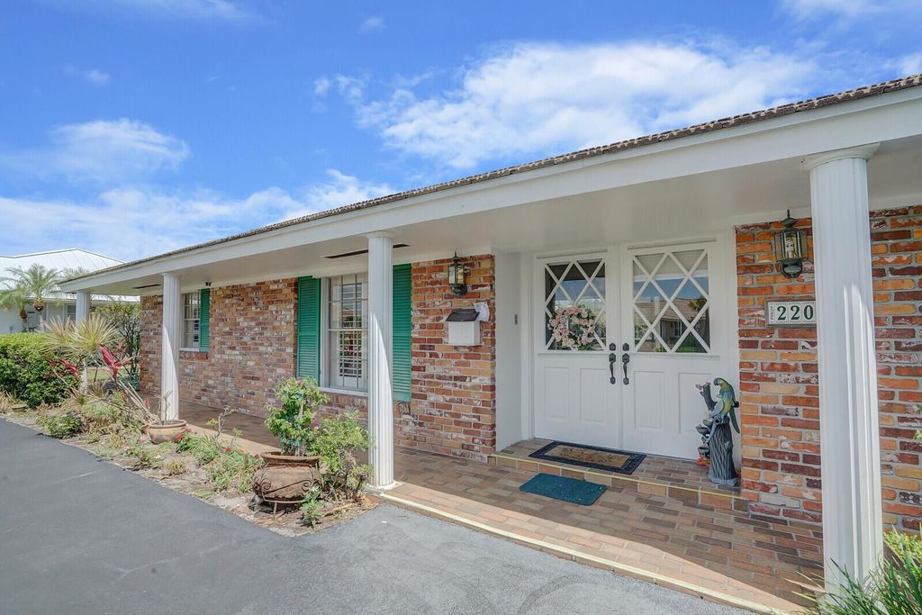 Photo of 220 N Country Club Drive, Atlantis, FL 33462 (MLS # R10987155)