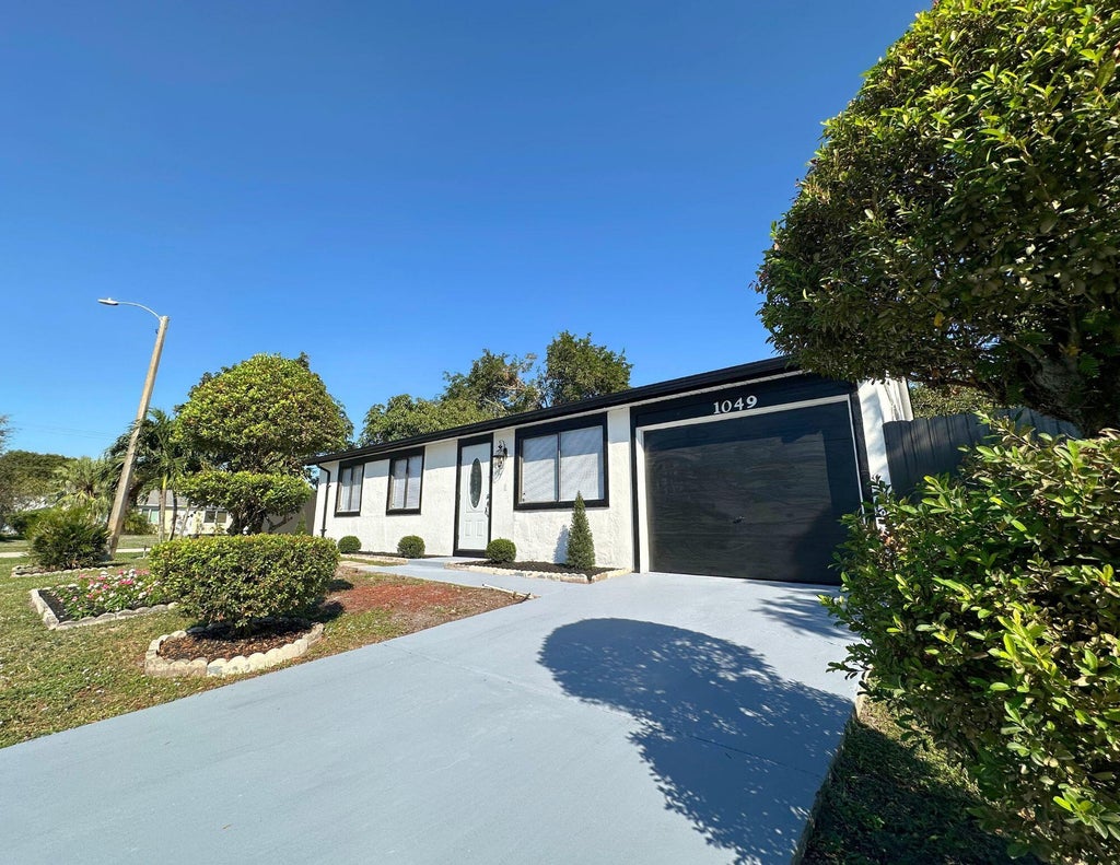 Photo of 1049 Grandview Circle, Royal Palm Beach, FL 33411 (MLS # B26035354)