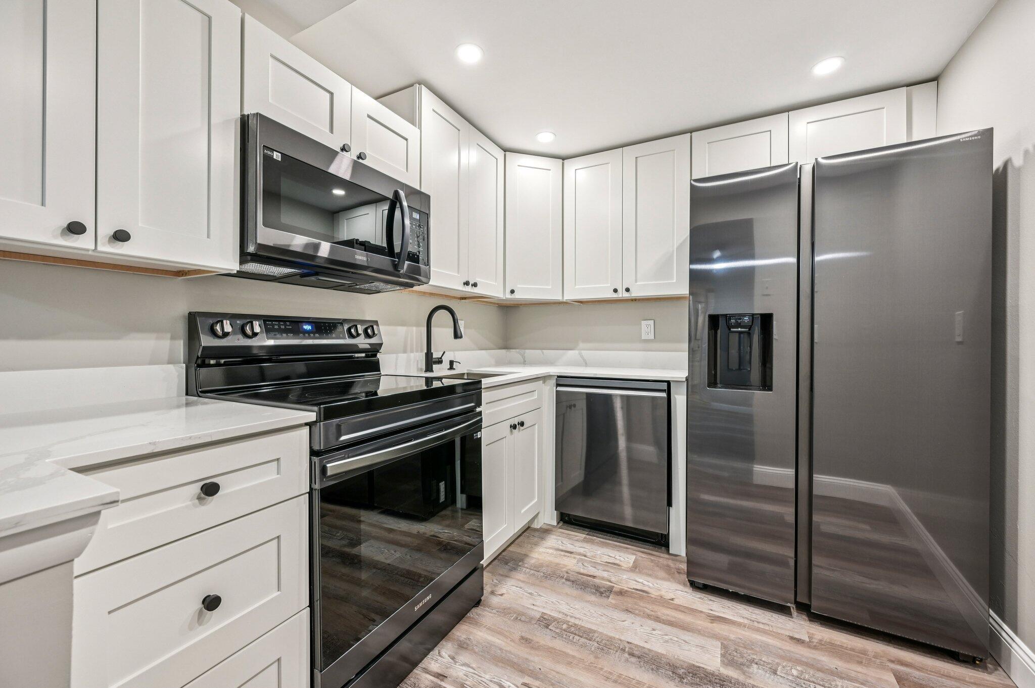 Absolutely immaculate 1st floor unit that has been completely updated featuring an in-unit full size washer & dryer. Stunning kitchen, gorgeous quartz counters, brand new black stainless, smudge free Samsung appliances. Every inch of millwork has been replaced w/elegant doors, frames and 5 1/4 base. Never lived on waterproof luxury vinyl flrs throughout. Recent central AC and water heater. Unit features a split bedrm flr plan, 2 walk in closets, and offers entry via the LR patio door steps to your car. Newly screened in porch. Gorgeous private pool, steps to El Rio walk/bike trail. Located adjacent to FAU allowing you to walk or bike to school. Community is very investor friendly, allowing immediate rentals. HOA covers water, pool, garbage and exterior. A+ Call today for a private showing