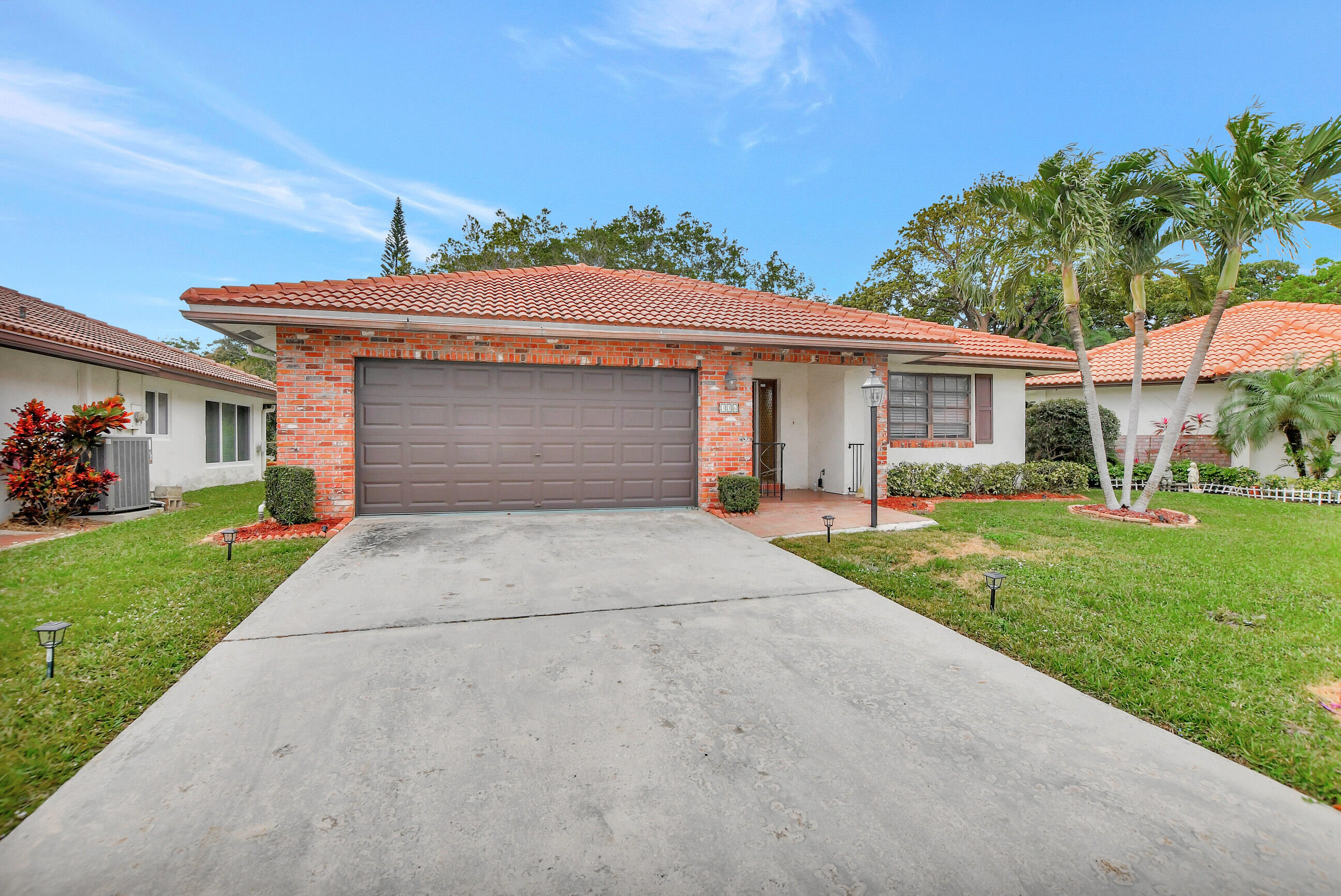 Welcome to this charming 2-bedroom, 2-bathroom home nestled in the desirable Knob Hill development. Featuring all-tile floors throughout, a 2-car garage, and no rear neighbors, privacy and comfort await. Enjoy relaxing in the screened Florida room just off the living room or take a short stroll to the nearby beach, only a mile away. With the convenience of walking to worship and being close to downtown Boca's vibrant Mizner Park, entertainment and cultural experiences are easily accessible. This community is perfect for those aged 55 and above, offering a heated pool, social activities, and beautifully maintained grounds. Plus, it's a pet-friendly environment, making it ideal for furry companions. Don't miss out on this opportunity to enjoy the best of comfort and convenience in Boca.