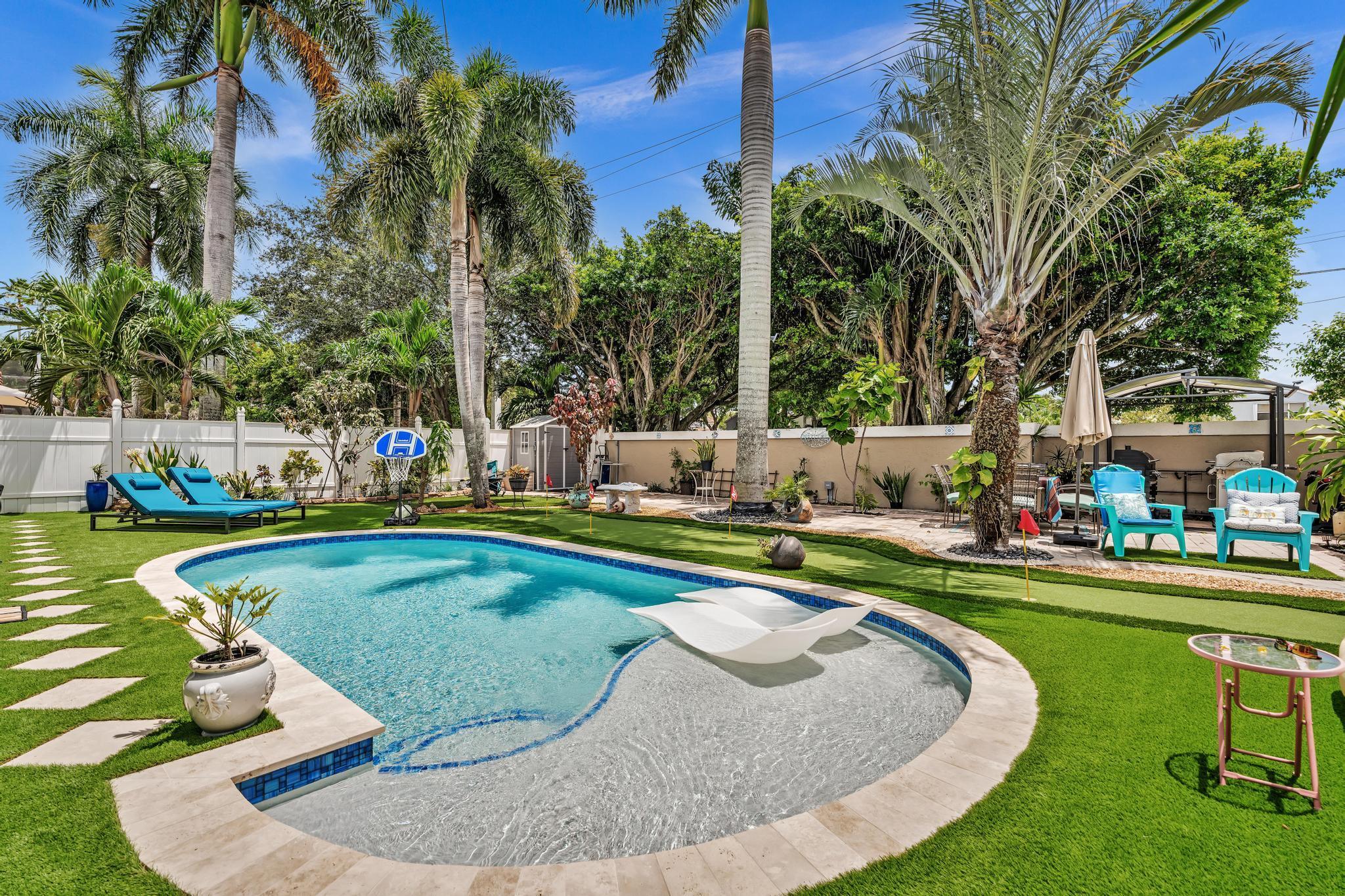 Delightful updated pool home in the heart of Boca Del Mar. 12 ft ceilings & a lot of windows make this home light & bright. Gorgeous cherry hard wood floors throughout most of the home. Remodeled, open kitchen with a beautiful center island, all wood cabinets & SS appliances. Both bathrooms have been tastefully updated. Absolutely stunning resort like pool area & large fenced back yard inclusive of beautiful screened in patio. Great for entertaining! Laundry room inside & 2 car garage. This small quaint neighborhood has an enjoyable community area that includes a clubhouse, pool, tennis court & basketball court. A short stroll to great restaurants, local gym &15 mins to the beach! Fantastic schools.