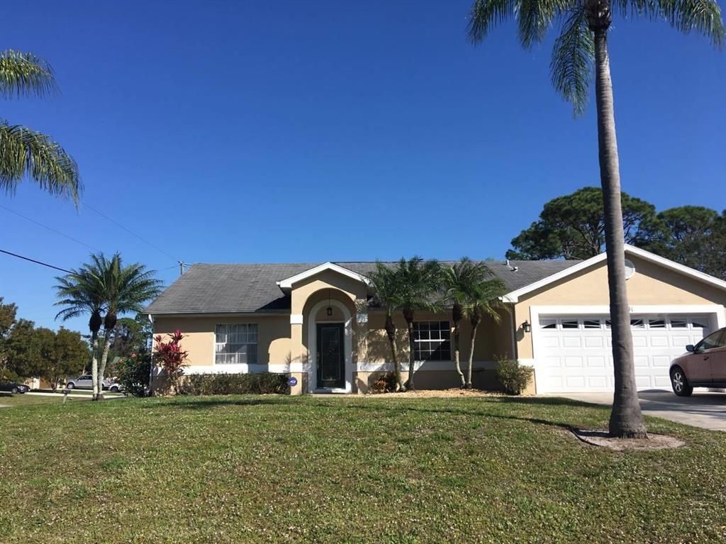 Photo of 1891 SW Grant Avenue, Port Saint Lucie, FL 34953 (MLS # R10716372)