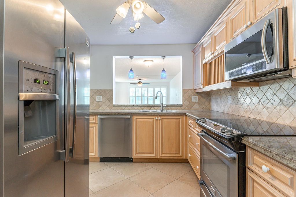 Photo of 2318 S Cypress Bend Drive #122, Pompano Beach, FL 33069 (MLS # F10500943)