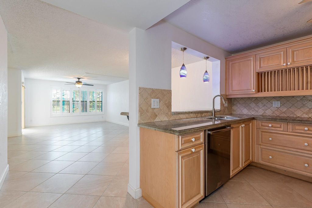 Photo of 2318 S Cypress Bend Drive #122, Pompano Beach, FL 33069 (MLS # F10500943)