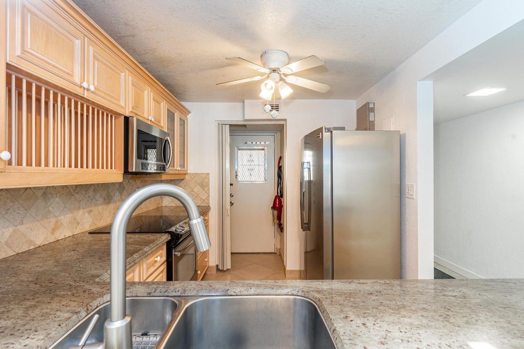 Photo of 2318 S Cypress Bend Drive #122, Pompano Beach, FL 33069 (MLS # F10500943)