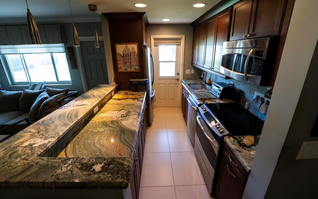 Beautifully designed 1 bedroom condo located in the desirable Lighthouse Point! Wide open kitchen features wood cabinetry, granite countertops, and stainless steel appliances. Bathroom has vanity with granite counters, bowl sink and a beautiful custom shower. Master bedroom has a walk-in closet and an additional storage closet. Just steps away from the community pool and laundry. This is a MUST SEE!!