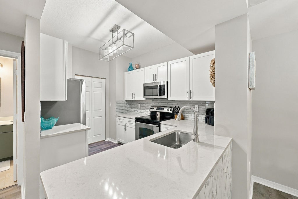 Photo of 4905 Midtown Lane #2112, Palm Beach Gardens, FL 33418 (MLS # B26082091)