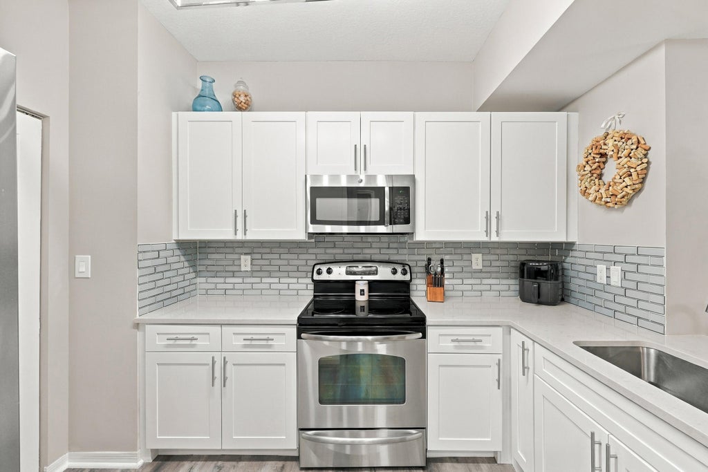 Photo of 4905 Midtown Lane #2112, Palm Beach Gardens, FL 33418 (MLS # B26082091)