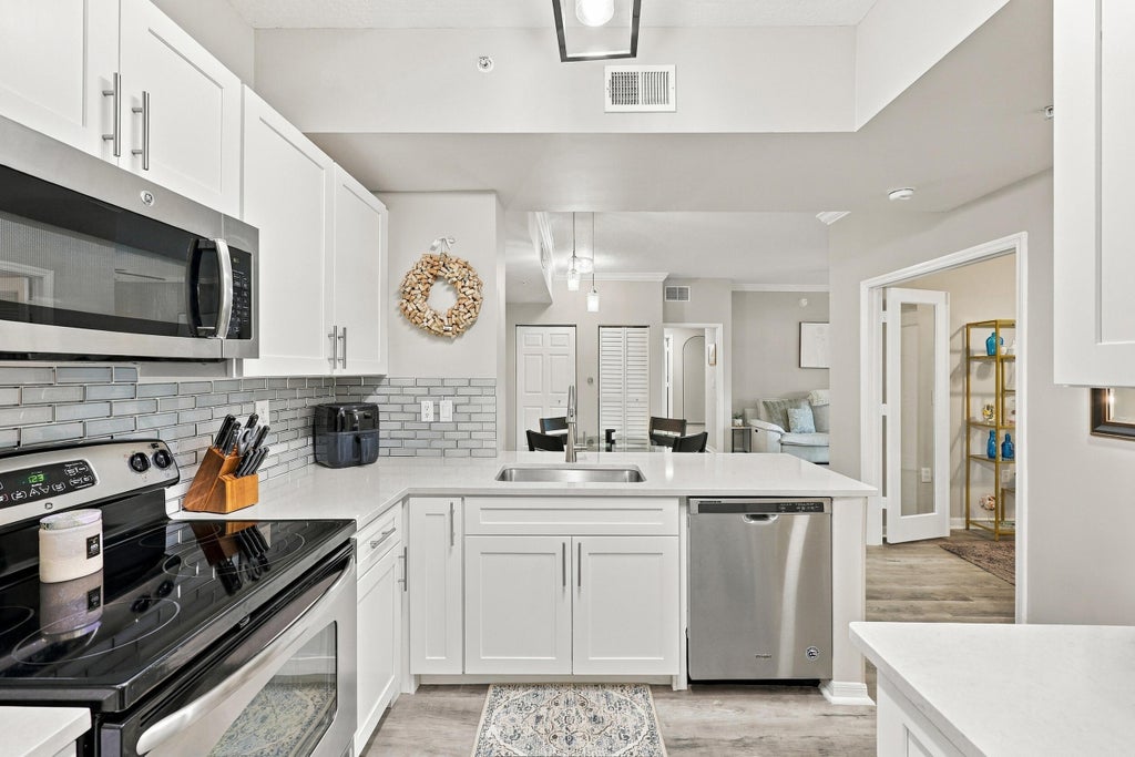Photo of 4905 Midtown Lane #2112, Palm Beach Gardens, FL 33418 (MLS # B26082091)