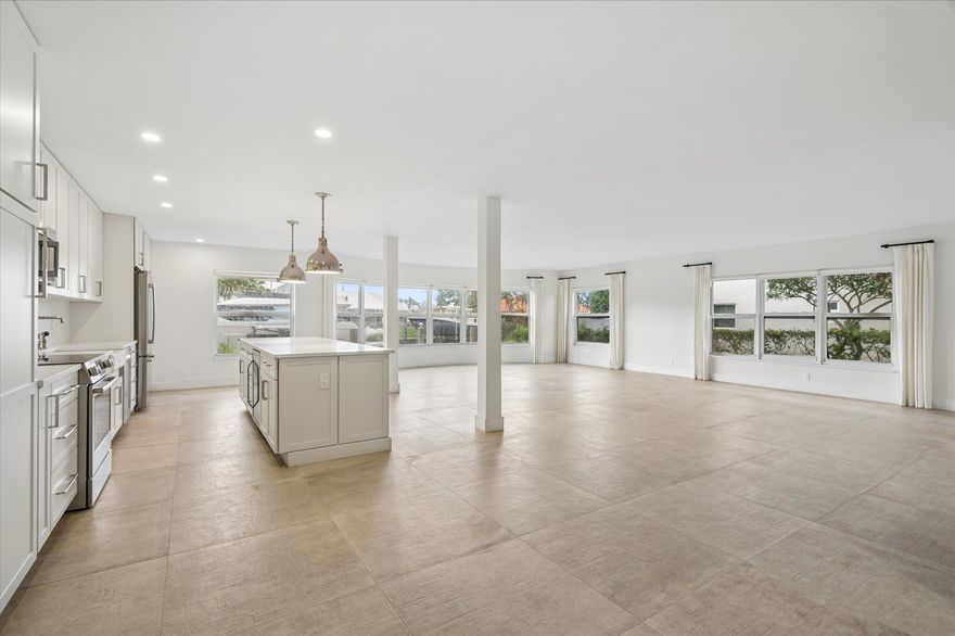 RARE 1ST FLOOR END-UNIT, FULLY RENOVATED WITH PANORAMIC WATERFRONT VIEWS in an exclusive 29-residence boutique building. 2BR/2BA: curated designer finishes; seamless open-concept layout. Expansive bay windows fill the home w/natural light. Chef's kitchen; oversized island; NEW BOSCH appliances; full-size Whirlpool in-unit laundry. Complete impact glass security. Private primary suite; custom walk-in closet. Guest room also w/custom closets,. Meticulously finished, abundant storage.  Direct ocean access-NO FIXED BRIDGES; seawall updated 2024. Resort-style amenities include pool, clubroom, &  rooftop terrace. NEW ROOF 2023. Milestone Inspections Completed. Minutes to beach, dining & Laud-by-the-Sea. Dockage for up to 25' boat. A refined waterfront lifestyle with effortless coastal elegance.  DRONE PHOTOS COMING SOON - DELAYED DUE TO WEATHER.