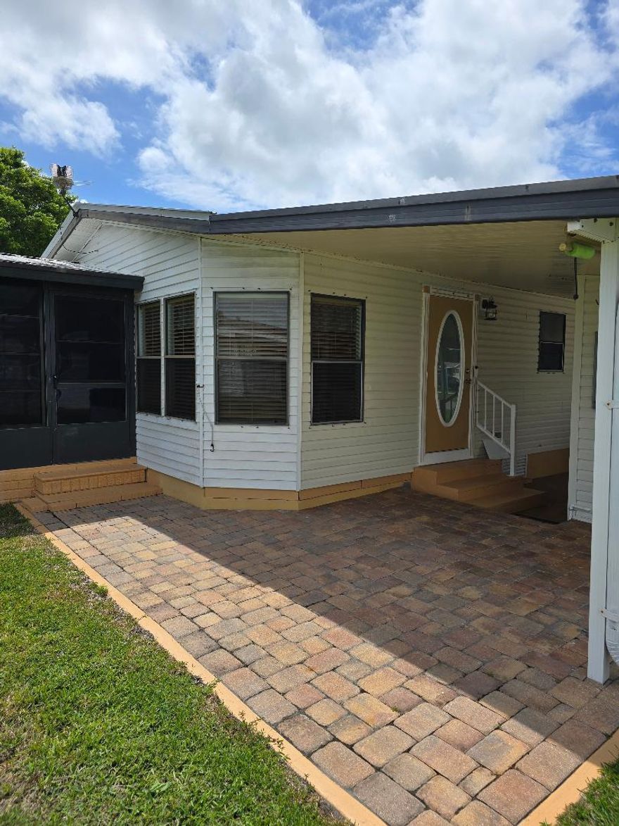 Waterfront mobile with 2 bedrooms and 2 baths. Metal roof install 2022. New air conditioning unit in 2018. Nice back porch looking over the lake. Beautiful clubhouse with heated pool and hot tub. Shuffle board, pickle ball and tennis. Weekly bingo in the clubhouse and pool tables.