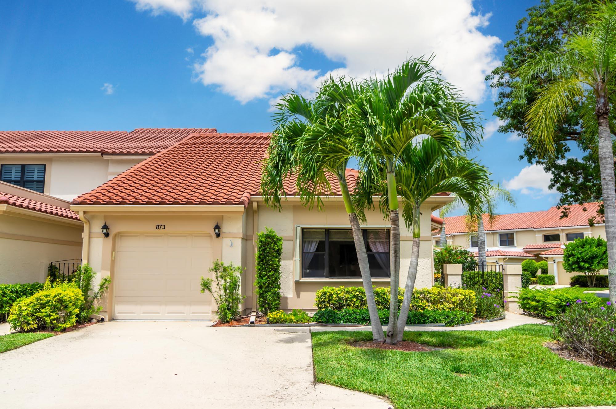 Available for Furnished annual, $3850, or $7,000/mo seasonally, Furnished only. Remodeled 3BR/2BA end-unit townhome in the sought-after community of Windermere at PGA National. This open floor plan offers volume ceilings, a bright living space with tons of windows letting in tons natural light, and a completely remodeled kitchen with beautiful neutral wooden cabinetry, granite countertops, and stainless-steel appliances. The second bedroom is located just off the living room and makes a perfect office, and the primary bedroom is spacious with a sliding glass door to the fantastic, enclosed patio offers tons of space for entertaining. New carpet in the primary bedroom/3rd bedroom, high-end LVT in the second bedroom/office. Windermere offers a community pool and pavilion for relaxation, an