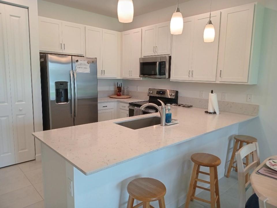 Furnished and ready for you to enjoy all the amenities Avalon Trails offers. Gated community near everything, shops, restaurants, easy commute to beach! Spacious living dining, split bedrooms, Den, upgraded quartz counter SS appliances in kitchen, walk in shower in master. Fully equipped kitchen, 1 car garage, great place to be for the winter luxury living!