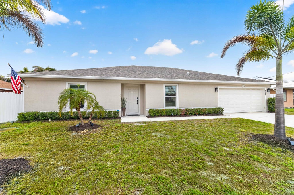 Photo of 571 SW Lairo Avenue, Port Saint Lucie, FL 34953 (MLS # B26030510)